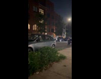 Man driving car without right front tire