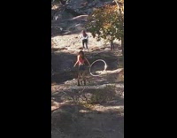 Woman pink crop top hula hoop river