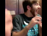 Guy throws dart misses hand dartboard kitchen 