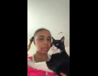 Womans cat stops crying when held like baby