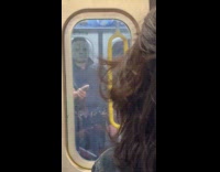 Man wearing scary latex mask for Halloween 