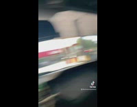 Girl in car with person waiting for gas pump empty stations open