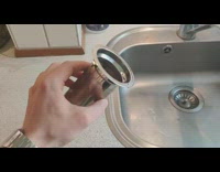 Guy washes cylinder tea filter whistling noise
