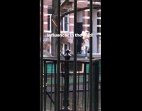 a girl with large silver balloons posing street