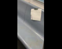 Paper sign taped onto seat says do not sit, seat full of poop, filthy dirty