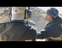 Helicopter machine gun shot by two guys 