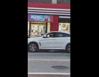 Little kid boy drives white SUV car