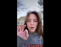 Girl wearing brown lion mascot costume catwalks 