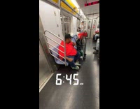 Man red shirt sing with microphone subway