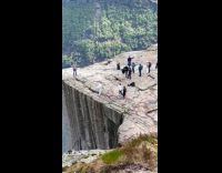 Two men near cliff edge for video