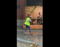 Guy balancing basketball dances to live music 