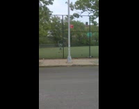Guy spins large cube sculpture around outside