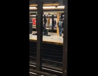 Guy waiting for subway plays drums
