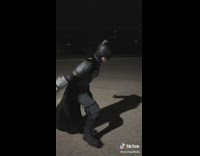 Guy in batman outfit beats up guy then hits griddy