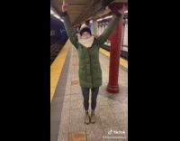 Guy taps lady on shoulder she turns around starts dancing 