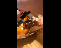 Filmer dunks chicken wing and sauce splashes