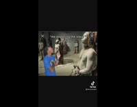Guy pretends to visit  slave exhibit 