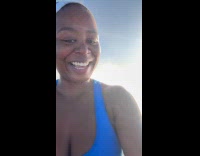 Woman touch clouds on top of mountain