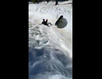 Man sledding falls from inflatable snow tube