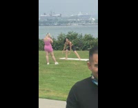 Woman workout video dumbbells public park