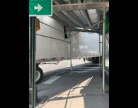 Delivery truck gets stuck on scaffolding pole 