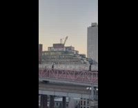 People ride top of j train 