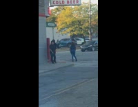 Woman blue outfit pictorial Liquor Store sidewalk