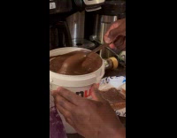 Man making sandwich with bucket of nutella 
