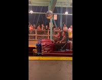 Two men front of fast roller coaster