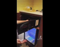 Woman puts food platter inside safe