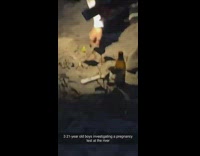 2 guys analyze pregnancy test outdoors 