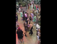 Three women danced with a jar of beer
