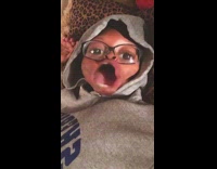 Dog puts paw on girls mouth 