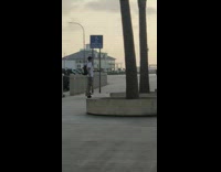 Guy white shirt one wheel board GoPro