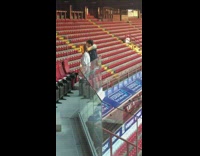 Guy and girl dance in empty stadium with no music