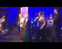 Old couple dance on stage live band