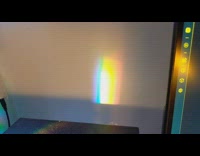 Glass of Aquarium produces rainbow color on the wall