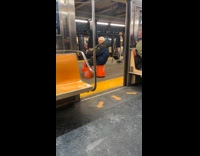 Man with bucket on legs play trombone