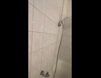 Shower head falling on tub