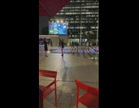 Woman in black dress tiktok dance at the fountain park