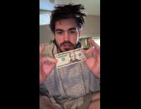 Man folds $20 into bowtie 