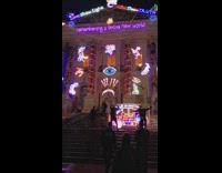 Two men mask dance Tate Britain Christmas Lights