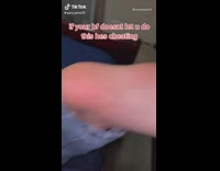 Girl writes her name on boyfriends foot in red sharpie marker