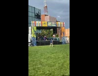 Man dance in front of live band stage