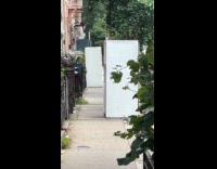 Refrigerators blocking sidewalk on street 
