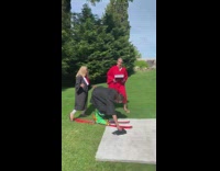 Black graduation gown guy skis wood ramp