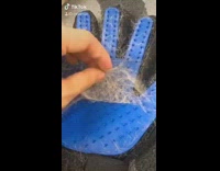 Guy makes hat using cat fur glove 