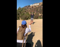 Old man beard black shirt hold Hollywood