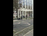 Lady poses by white beams 