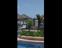 Man walks on resort selfie video with monkey puppet